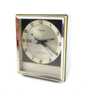 A mid-Century Japanese Rhythm mantel clock, of rectangular form, with silvered dial bearing Arabic numerals, centre seconds and day date, with auto calendar and alarm clock, in a grey plastic case, no 51012, 14cm high.