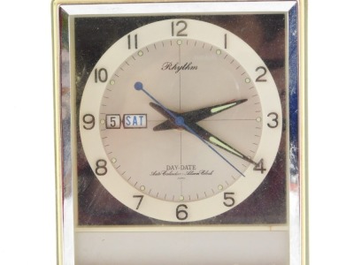 A mid-Century Japanese Rhythm mantel clock, of rectangular form, with silvered dial bearing Arabic numerals, centre seconds and day date, with auto calendar and alarm clock, in a grey plastic case, no 51012, 14cm high. - 2