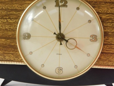 A Smiths 1950's mantel clock, the circular cream dial bearing Arabic numerals at quarters, clockwork movement, the brown bakelite case with faux wood front, 22cm wide. - 2