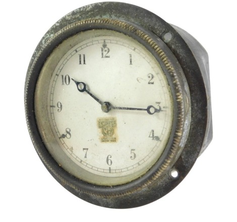 A Smiths Clock Company car clock, in black metal casing, on a silvered dial, 9cm wide.