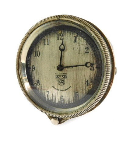 A Smiths Clock Company car clock, in silvered outer casing, on a silvered dial, 8cm wide.