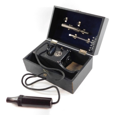 An Everay electric chock therapy instrument, black cased.