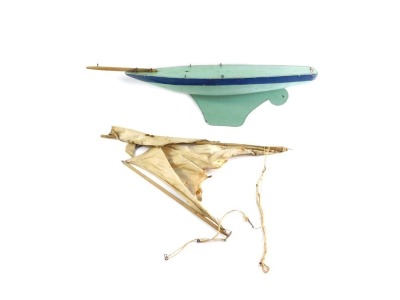 A painted wooden and metal pond yacht and mast, 56cm wide.