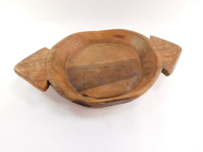 A turned wooden twin handled bowl, possibly northern European, with two triangle shaped handles, 65cm wide, 40cm deep. - 2