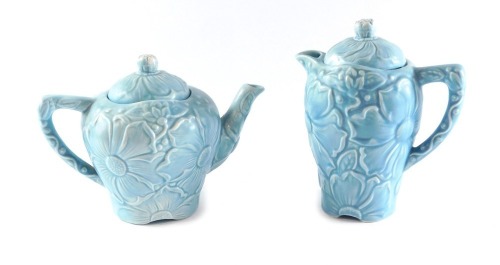 Two Kensington turquoise pottery Sunflower pattern pots, comprising coffee pot and teapot, each stamped to underside, 20cm and 17cm high. (2)