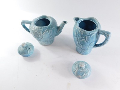 Two Kensington turquoise pottery Sunflower pattern pots, comprising coffee pot and teapot, each stamped to underside, 20cm and 17cm high. (2) - 2