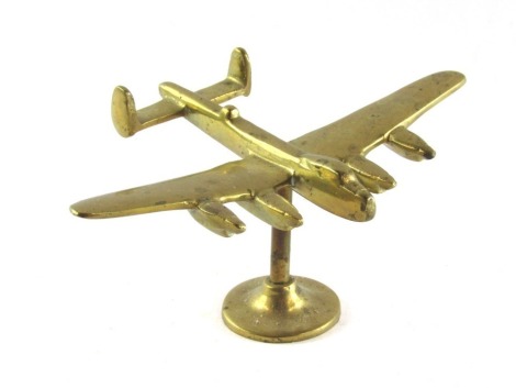 A brass desk stand of a Lancaster bomber, 8cm high, 19cm wide, 15cm deep.