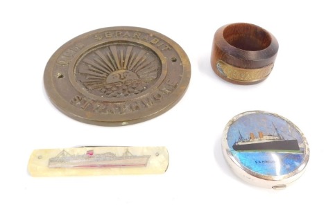 Naval interest. A mother of pearl Stirling Castle pen knife, a wooden napkin ring from the teak of HMS Valiant, Jutland 1916, a butterfly wing and chrome SS Montcalm powder box and a Quis Separabit Strathmore brass plaque. (4)