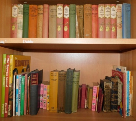 A group of paperback books, to include The Collection of Dornford Yates, with paper bindings and various other children's books, etc. (2 shelves)