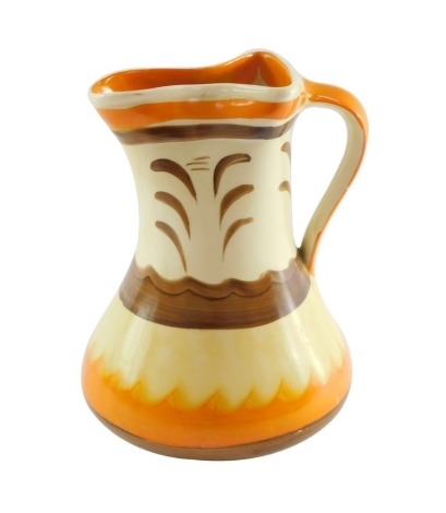 A Myott Son & Co 1930's painted jug, on a cream ground with orange and brown painted detailing, 20cm high.