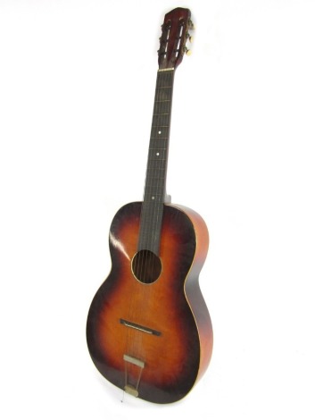 An Acoustic guitar, with two tone detailing.