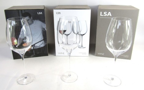 A set of nine LSA red wine goblet glasses, in three boxes.
