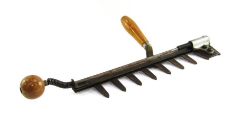 A vintage hedge trimmer, stamped Code Half Time, patent number 16418-49, 54cm long.