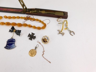 A small group of jewellery, silver and effects, a set of half guinea postage scales in fitted case, a single rose gold part chain, a Deutsch 5 mark single earring, a Victorian silver brooch, enamel pins, silver scent bottle top, imitation amber beads, etc - 3