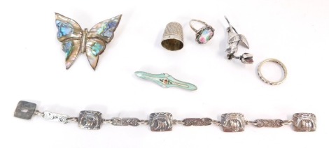 A group of silver and other jewellery, to include a Viking bracelet stamped Sterling, a mother of pearl inlaid butterfly brooch stamped 925, a rose brooch, silver thimble, enamel set silver brooch and a silver and marcasite dress ring. (a quantity)