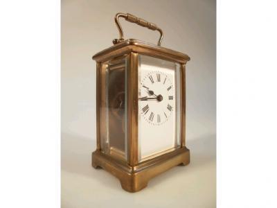 A 20thC French gilt brass carriage timepiece of traditional form