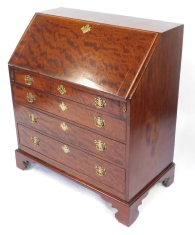 A George III plum pudding mahogany bureau, the fall flap opening to reveal a fitted interior, with a central paneled door, over a drawer flanked by two semi secret pilaster compartments, six recesses with shaped drawers below, and six stepped drawers, ove