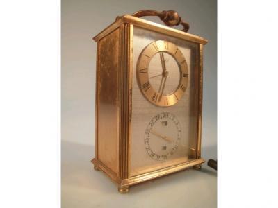 A modern brass carriage timepiece