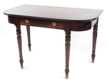 A Georgian mahogany D-end table, the reeded top above a single frieze drawer, raised on turned legs, 72cm high, 113cm wide, 62cm deep.