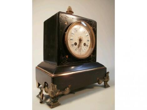 A late Victorian slate mantel clock with pineapple finial