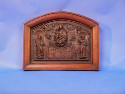 A framed oak carved panel