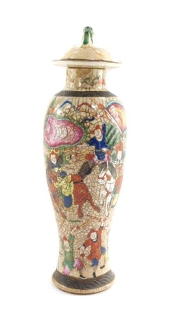 A Japanese Satsuma vase and cover, of baluster form, the lid with lion dog finial, decorated with warriors, seal mark, 39cm high. (AF)