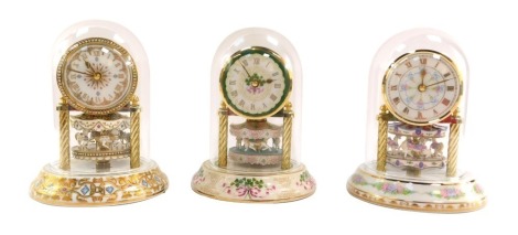Three Arzberg porzellan anniversary clocks for Franklin Mint, comprising Grand Carousel Anniversary, another similar, and Spirit of America, 17cm high, each boxed.