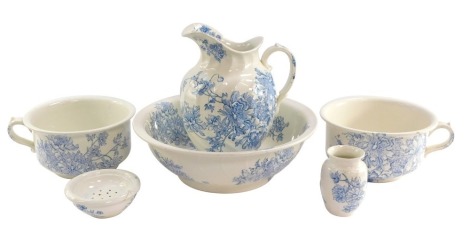 A Sampson Bridgwood & Son blue and white pottery toilet set, decorated in the Peony pattern, printed marks, comprising jug and bowl, pair of chamber pots, soap dish and drainer, and a toothbrush holder. (6)