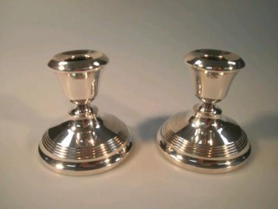 A pair of silver dwarf candlesticks