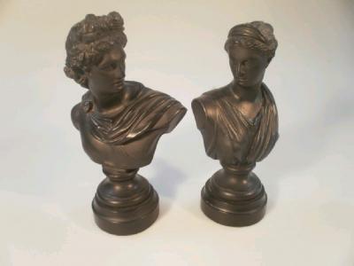 A pair of 19thC bronzed spelter busts in the neo-classical style on turned socles