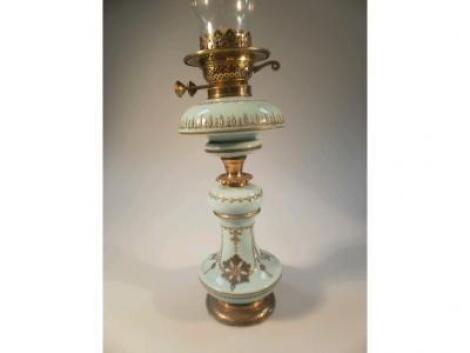 A Victorian turquoise enamelled glass oil lamp with double burner