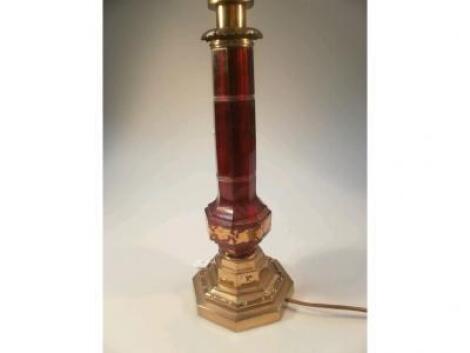 A late Victorian Bohemian cut ruby glass table lamp with gilt telescopic