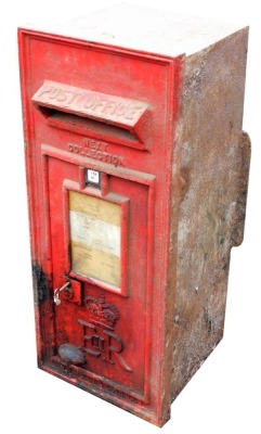 A Post Office red cast iron wall mounted letter box, Elizabeth II, 138, number 1, with key, 85cm high, 35cm wide.