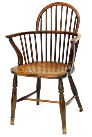 A 19thC yew and elm Windsor chair, with spindle turned back, solid seat, on turned legs with H stretcher.