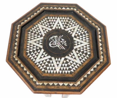 An early 20thC Anglo Indian hardwood occasional table, the octagonal top inlaid in mother of pearl within parquetry bands, the base with similar decoration in Liberty style, 54cm high, 51cm wide. - 2