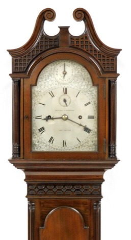 Ollivant and Botsford, Manchester. A grandmother clock, the silvered dial with blackened Roman numerals and engraved borders, with a four pillar movement in a mahogany case with swan neck pediment, blind fret frieze and a figured arched door on splayed fe
