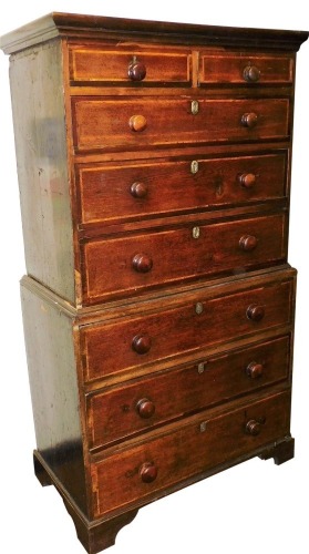 A 19thC oak and feather banded chest on chest, the top with a moulded cornice above two short and three long drawers, each with later turned wooden handles, the base with a further three long drawers, on bracket feet, 179cm high, 97cm wide. (AF)