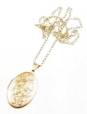 A 9ct gold locket pendant and chain, the oval floral embossed pendant opening to reveal a double photograph section, 3.5cm high, on a fine link chain, 60cm long, 5.2g all in.