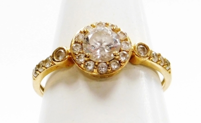 A 9ct gold and cubic zirconia set Victorian memorial style dress ring, the central cluster with large stone surrounded by smaller stones, with single stone circle set shoulders and three stone set ribbed detailing, ring size O, 1.7g all in.