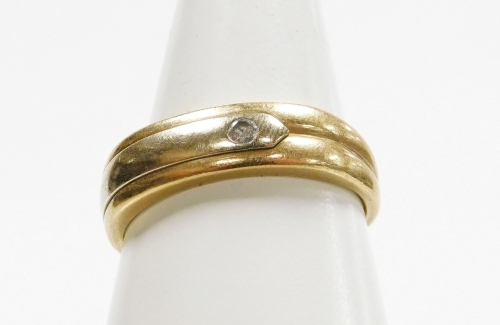 A 9ct gold dress ring, with three row banded design and set with tiny diamond, in tension setting, ring size T, 2.8g all in.