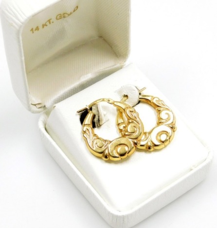 A pair of 9ct gold hoop earrings, each of wave design with single clip loop, 2cm high, 2.2g all in, boxed.