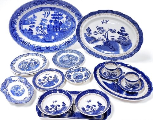 A group of blue and white pottery, including Royal Doulton Booths Real Old Willow, dinner and coffee wares, Spode Italian sauce boat stand and Masons Willow pattern plates. (a quantity)