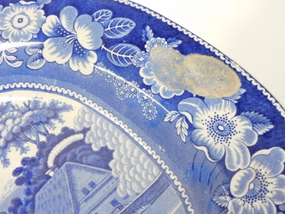 Five 19thC blue and white meat platters, comprising a platter decorated with a romantic landscape within a floral border, Nuneham Courtnay pattern meat platter and three Willow pattern meat platters. - 3