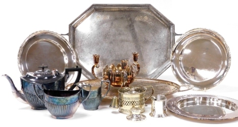 Silver plated wares, including two twin handled trays, semi fluted three piece teaset, bread plates, and a mustard pot, together with a George V silver capstan inkwell, Birmingham 1910.