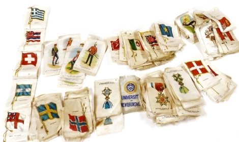 Kensitas silks cigarette cards, including flags and arms of nations, medals and decorations, regimental uniforms, butterflies and animals. (a large quantity)