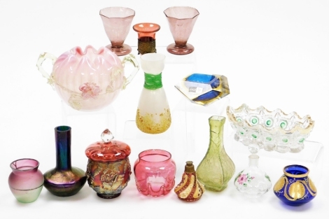 Victorian and later coloured glassware, including Loetz style vases, cranberry glass, scent bottles, and a Victorian twin handled vaseline glass vase. (a quantity)