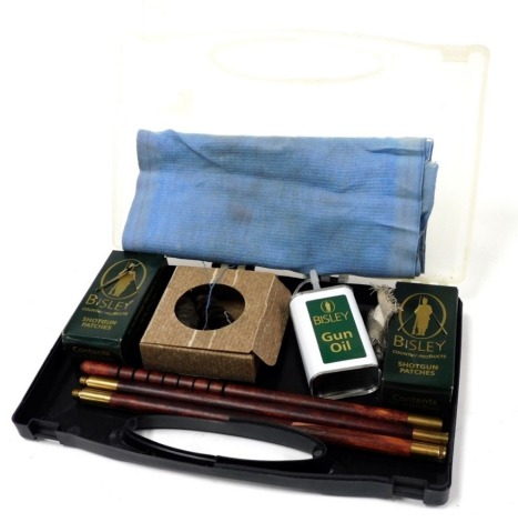 A gun cleaning kit, with Bisley shotgun patches and an oil gun, cased.