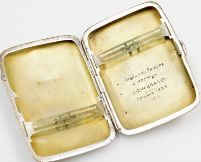 A group of small silver, a cigarette case, of plain form, the interior inscribed with dedication, Birmingham 1925, a bookmark modelled in the form of a trowel, Birmingham 1892, and a hinged bangle, Birmingham 1971, 2¾oz overall. - 2