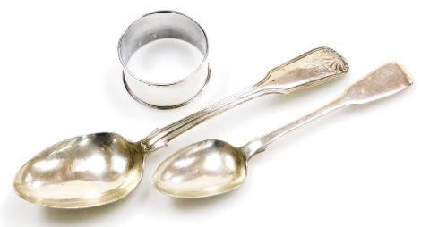 Three items of small silver, a George III silver fiddle pattern teaspoon, London 1798, a silver napkin ring, Sheffield 1977, and a George III silver fiddle pattern dessert spoon, London 1783, 2½oz all in.