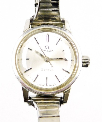 An Omega lady's stainless steel and plated wristwatch, the silver coloured dial with batons, stamped Omega Geneva, Swiss made, the dial 2cm diameter.